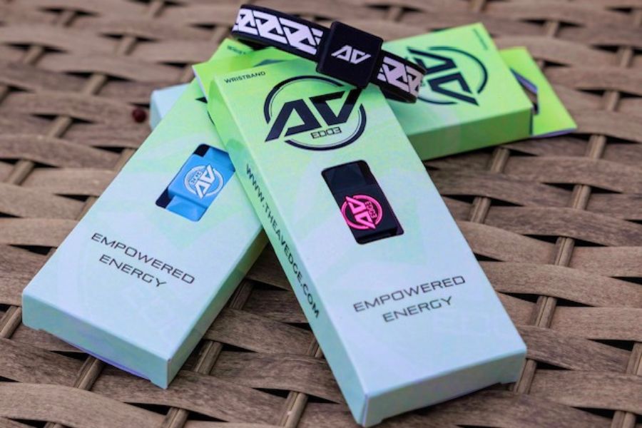A curated selection of AV Edge Legend and Advanced frequency wristbands in multiple colours, including White/Black, Noir, Cranberry, Black/Pink, and Sky Blue, designed for natural balance and EMF protection.