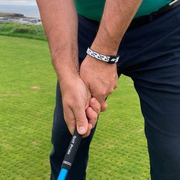 golfer wearing the AV Edge Legend golfers bracelet to increase club head speed