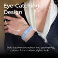 A close-up of a customer wearing the AV Edge Advanced Sky Blue frequency wristband paired with a smart black cardigan, highlighting the modern geometric design that might support improved focus, balance, and natural energy throughout a busy day.