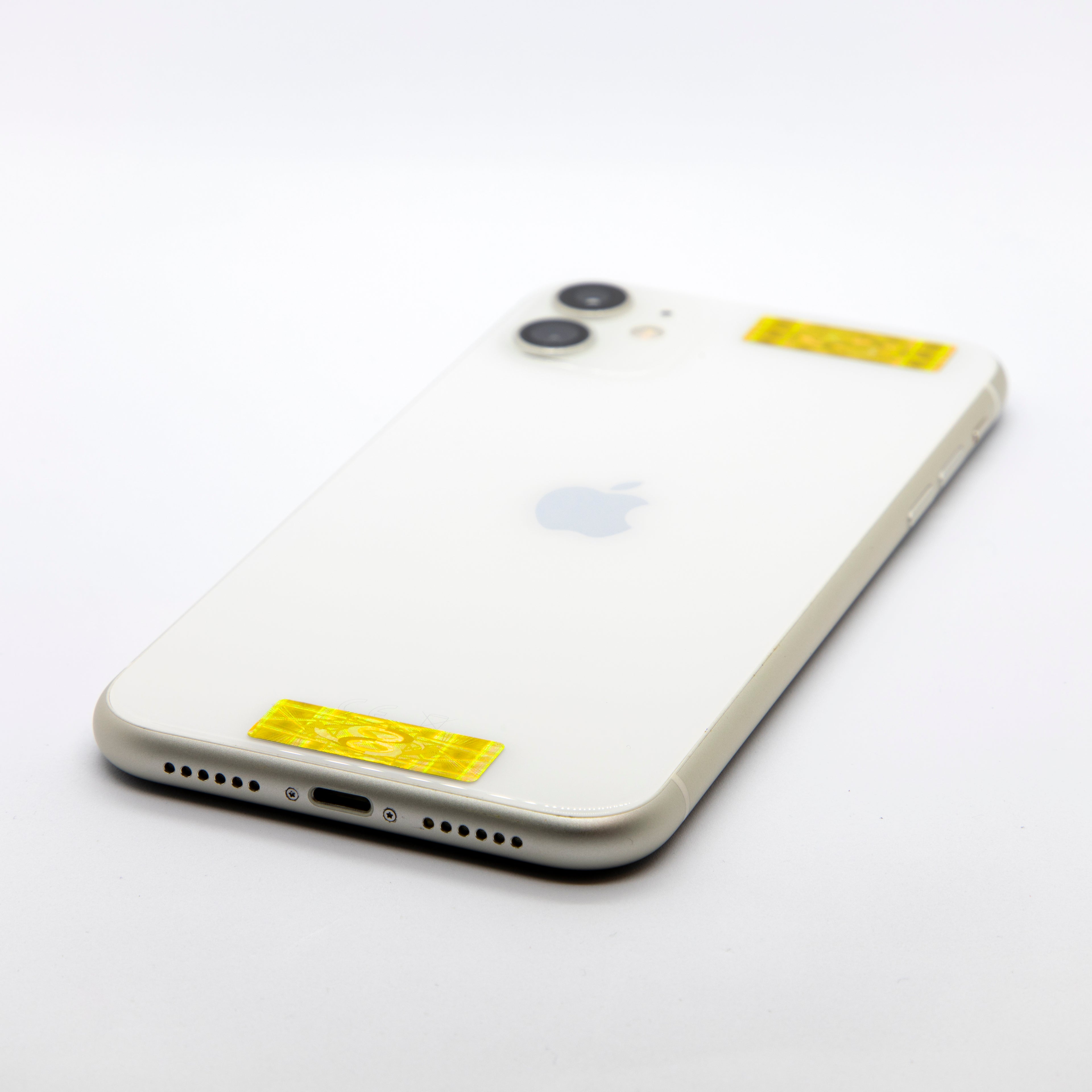 Smartphone with a white back and Apple logo on a light grey background with AV Edge protect filters that may protect against modern technology EMFs