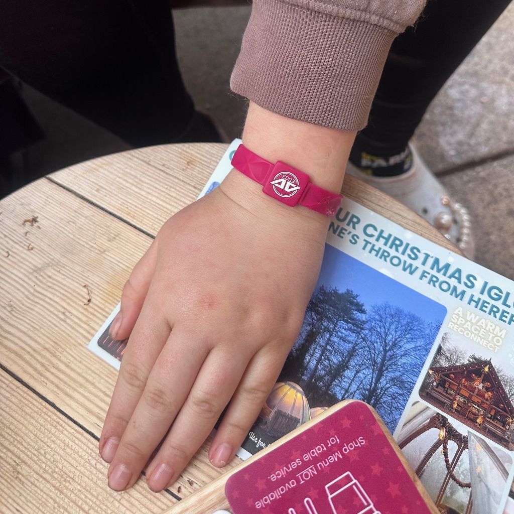 Jo Alderton wearing the Cranberry-coloured AV Edge Advanced wristband with EF Technology (frequencies, not magnets) That May Protect Against EMFs and Stimulate the Production of ATP to Help Improve Health and Performance.