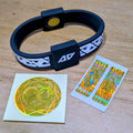 Everyday Protection Starter Set showing a black Legend frequency technology wristband alongside a gold circular laptop/tablet EMF protect filter and two gold rectangular mobile phone EMF protect filters on backing paper.
