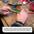 AV Edge Legend Noir frequency bracelet worn by an artisan crafting stained glass, demonstrating how non-magnetic technology might support improved focus, balance, and energy while potentially providing natural relief from arthritis or joint stiffness during delicate handiwork.